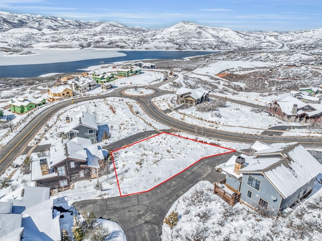 10740 N Hideout Trl, Hideout, UT 84036 - snowy aerial view featuring a mountain view and a residential view