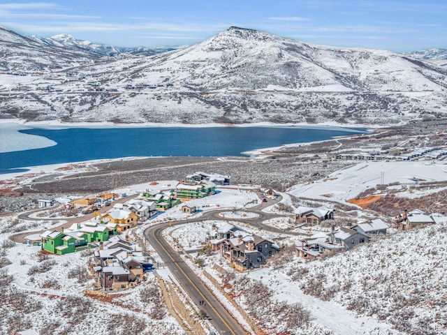 10740 N Hideout Trl, Hideout, UT 84036 - snowy aerial view featuring a water and mountain view