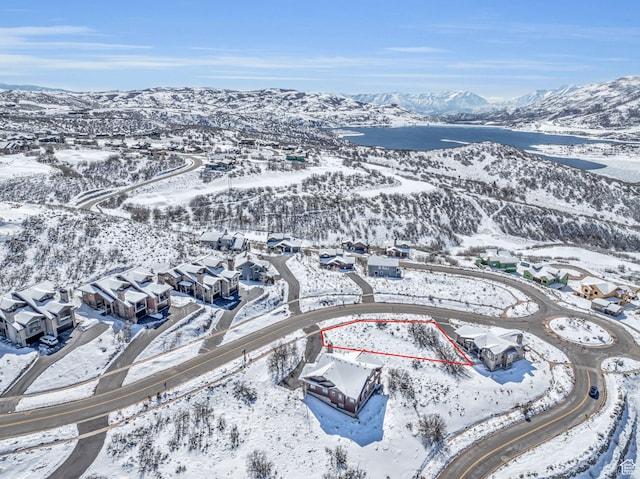 10740 N Hideout Trl, Hideout, UT 84036 - snowy aerial view featuring a mountain view and a residential view