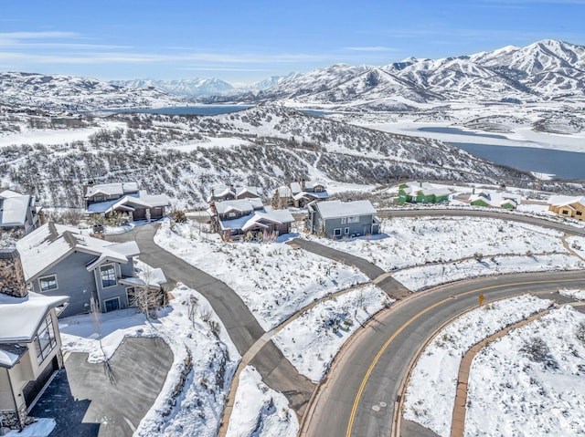10740 N Hideout Trl, Hideout, UT 84036 - snowy aerial view featuring a mountain view and a residential view
