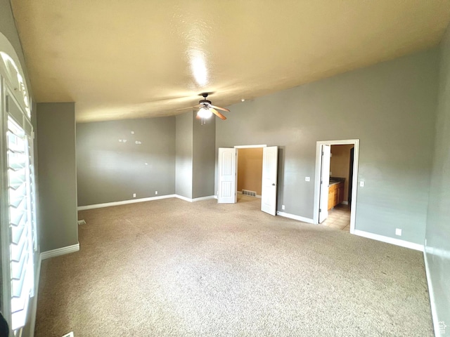 15 E 1100 S, Vernal, UT 84078 - unfurnished bedroom with visible vents, lofted ceiling, baseboards, light colored carpet, and ceiling fan