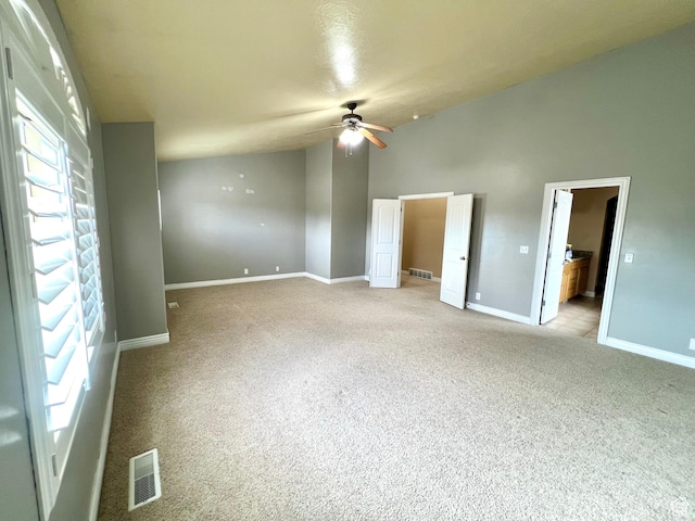 15 E 1100 S, Vernal, UT 84078 - unfurnished bedroom featuring baseboards, visible vents, lofted ceiling, and light carpet