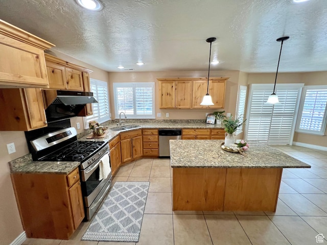 15 E 1100 S, Vernal, UT 84078 - kitchen featuring a sink, light tile patterned floors, a healthy amount of sunlight, and stainless steel appliances