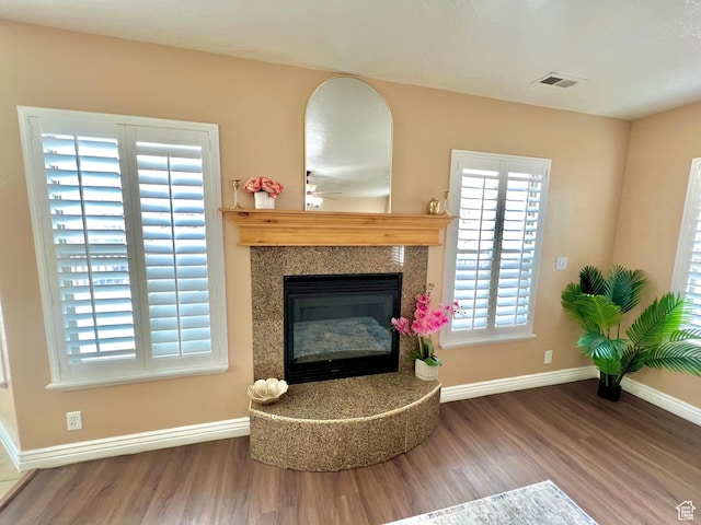 15 E 1100 S, Vernal, UT 84078 - interior details featuring visible vents, a fireplace, baseboards, and wood finished floors