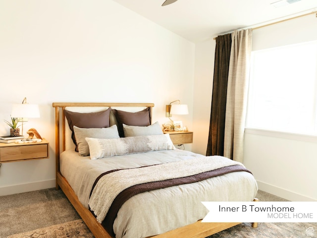 carpeted bedroom with baseboards