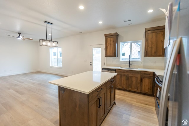 1183 S 1335 E Unit 76, Garland, UT 84312 - kitchen with visible vents, refrigerator, light countertops, and a sink