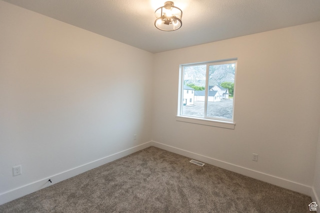 1183 S 1335 E Unit 76, Garland, UT 84312 - empty room with carpet flooring, visible vents, and baseboards