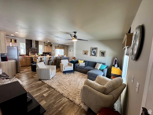 924 E Breeze Way Unit 106, Garden City, UT 84028 - living area with dark wood-style floors and a ceiling fan