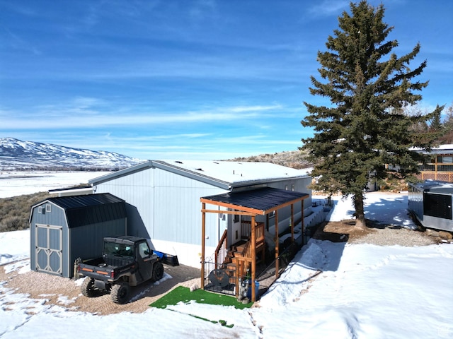 924 E Breeze Way Unit 106, Garden City, UT 84028 - snow covered structure with a shed and an outdoor structure