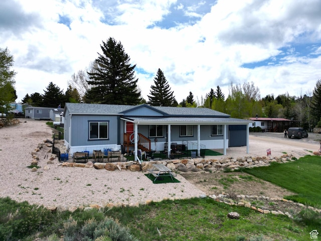 924 E Breeze Way Unit 106, Garden City, UT 84028 - ranch-style house with covered porch and a shingled roof