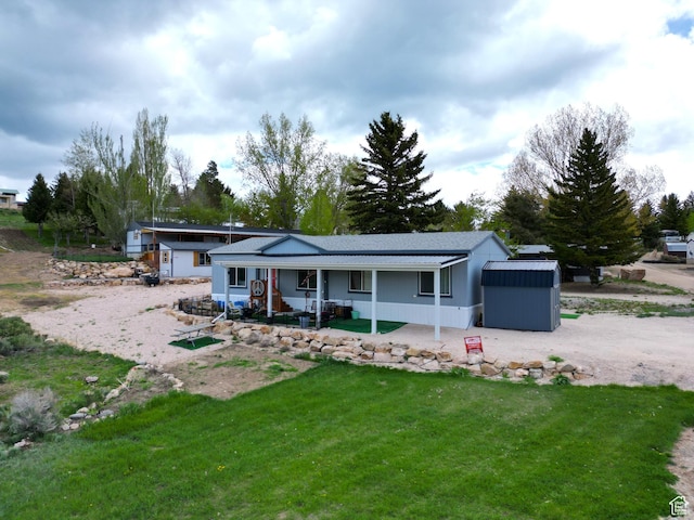 924 E Breeze Way Unit 106, Garden City, UT 84028 - rear view of property featuring a porch and a yard