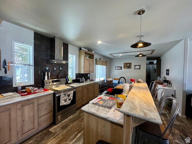 924 E Breeze Way Unit 106, Garden City, UT 84028 - kitchen featuring stainless steel electric range oven, wall chimney range hood, dark wood-style flooring, and light countertops