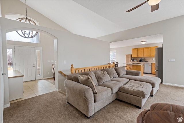 2144 N 750 W, Clinton, UT 84015 - living area featuring light colored carpet, ceiling fan, a chandelier, light tile patterned floors, and baseboards