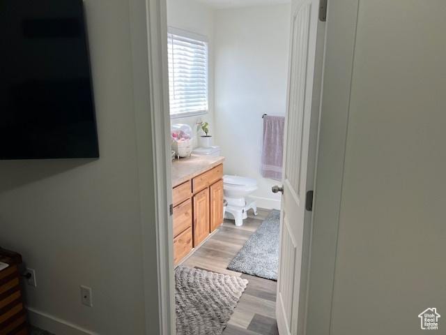 2048 W Brynn Ave S Unit 7, West Haven, UT 84401 - bathroom with vanity, toilet, and wood finished floors