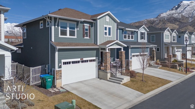 4672 W Tulip N, Cedar Hills, UT 84062 - view of front of home featuring fence, driveway, a garage, stone siding, and board and batten siding