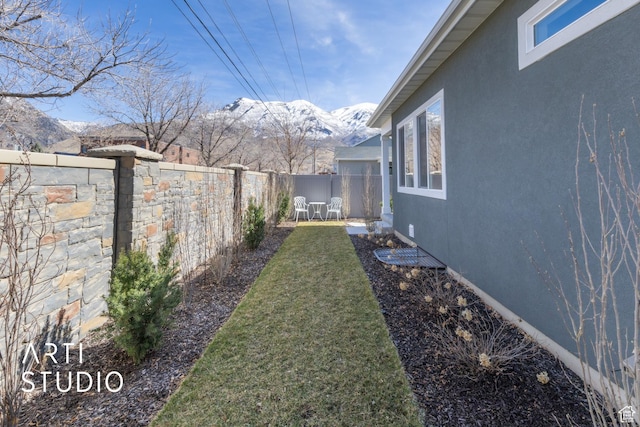 4672 W Tulip N, Cedar Hills, UT 84062 - view of yard with a mountain view and a fenced backyard