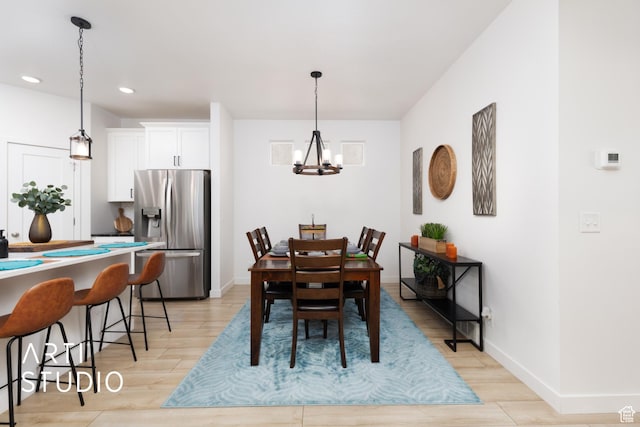 4672 W Tulip N, Cedar Hills, UT 84062 - dining space featuring a notable chandelier, recessed lighting, light wood-type flooring, and baseboards
