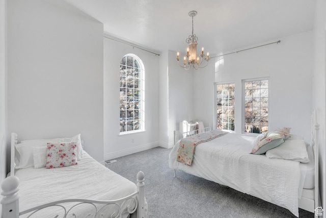 2382 S Spanish Oaks Dr, Spanish Fork, UT 84660 - carpeted bedroom featuring baseboards and a notable chandelier
