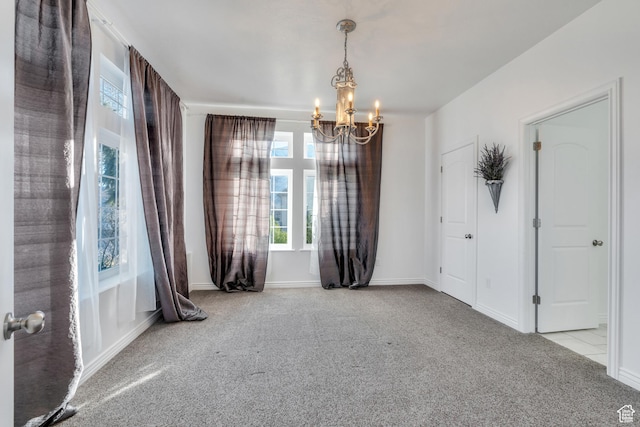 2382 S Spanish Oaks Dr, Spanish Fork, UT 84660 - carpeted empty room with baseboards, plenty of natural light, and a chandelier