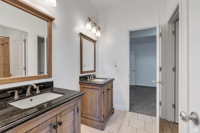 2382 S Spanish Oaks Dr, Spanish Fork, UT 84660 - bathroom with a sink, baseboards, tile patterned flooring, and two vanities
