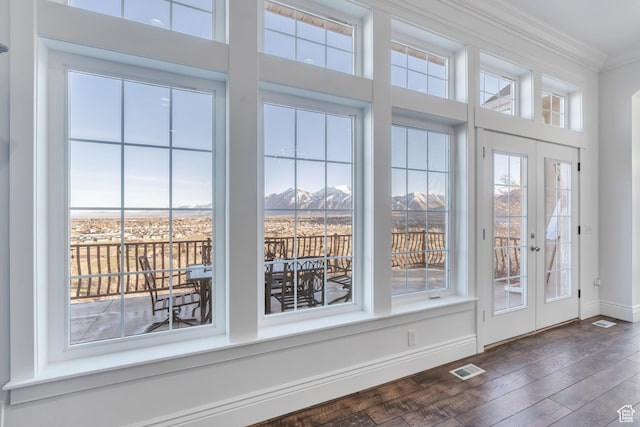 2382 S Spanish Oaks Dr, Spanish Fork, UT 84660 - entryway featuring visible vents, ornamental molding, baseboards, dark wood-type flooring, and a mountain view
