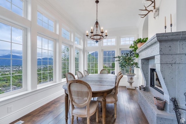 2382 S Spanish Oaks Dr, Spanish Fork, UT 84660 - dining room featuring crown molding, a mountain view, dark wood-style floors, and an inviting chandelier