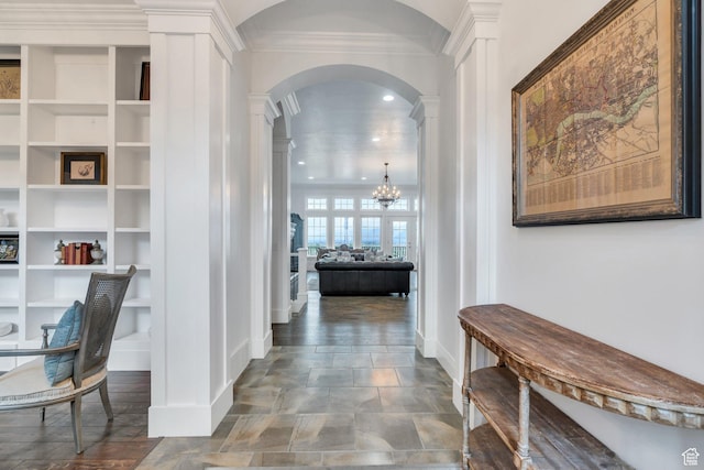 2382 S Spanish Oaks Dr, Spanish Fork, UT 84660 - hall featuring an inviting chandelier, crown molding, decorative columns, baseboards, and arched walkways