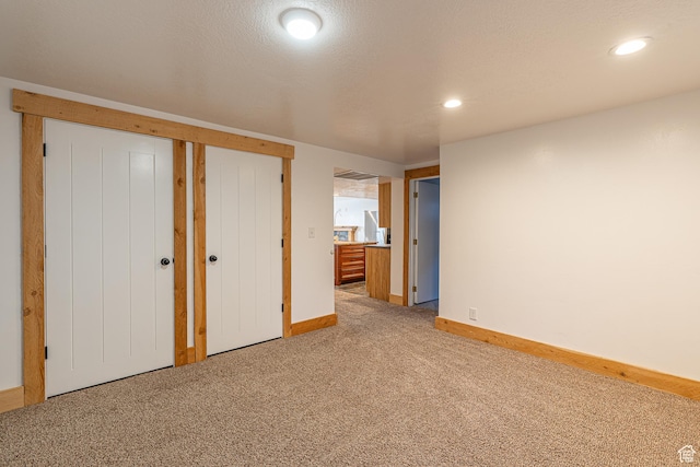 717 E Park Dr N, Hyrum, UT 84319 - unfurnished bedroom with carpet flooring, recessed lighting, baseboards, and a textured ceiling