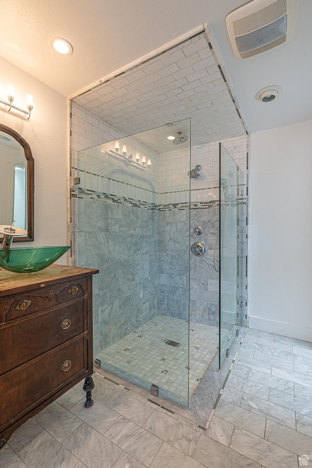 717 E Park Dr N, Hyrum, UT 84319 - full bathroom with vanity, visible vents, marble finish floor, and a stall shower