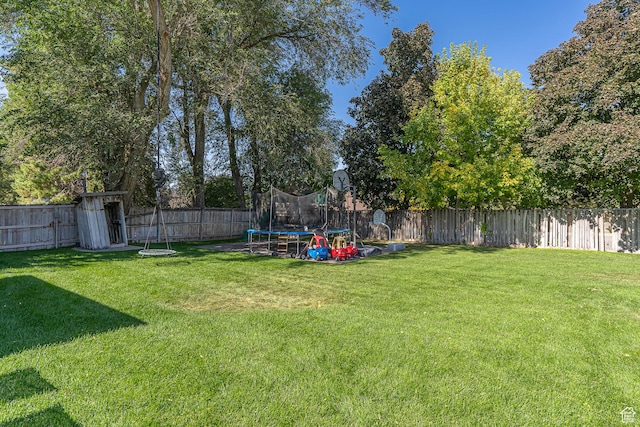 717 E Park Dr N, Hyrum, UT 84319 - view of yard featuring a fenced backyard and a trampoline
