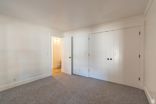 717 E Park Dr N, Hyrum, UT 84319 - unfurnished bedroom with crown molding, carpet, a closet, and baseboards