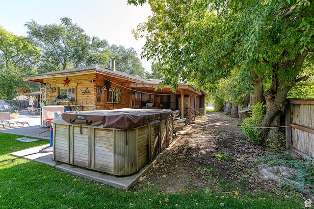 717 E Park Dr N, Hyrum, UT 84319 - back of property with a patio area, fence, and a hot tub