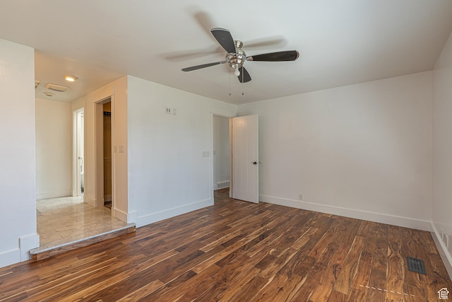717 E Park Dr N, Hyrum, UT 84319 - spare room featuring visible vents, baseboards, and dark wood-style floors