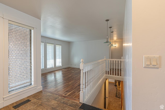 717 E Park Dr N, Hyrum, UT 84319 - corridor with hardwood / wood-style floors, an upstairs landing, visible vents, and baseboards