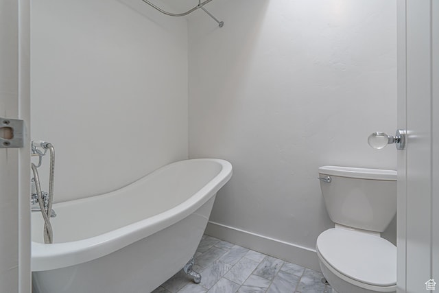 717 E Park Dr N, Hyrum, UT 84319 - full bath featuring a freestanding tub, baseboards, toilet, and marble finish floor