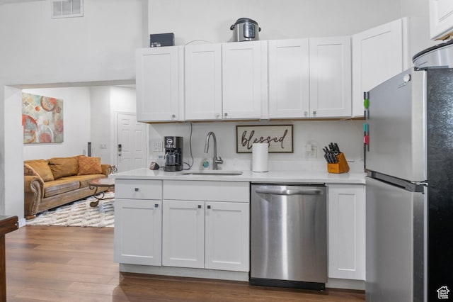 739 24th St, Ogden, UT 84401 - kitchen with visible vents, stainless steel appliances, light countertops, and a sink