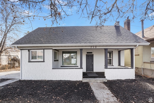 739 24th St, Ogden, UT 84401 - bungalow-style home with brick siding, covered porch, a chimney, and a shingled roof