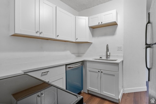 739 24th St, Ogden, UT 84401 - kitchen with dark wood finished floors, freestanding refrigerator, a sink, a textured ceiling, and stainless steel dishwasher