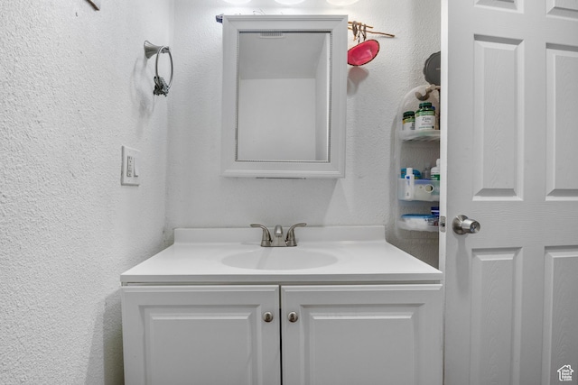 739 24th St, Ogden, UT 84401 - bathroom with vanity and a textured wall