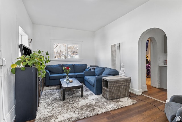 739 24th St, Ogden, UT 84401 - living area featuring wood finished floors and arched walkways