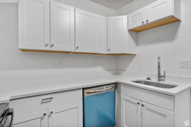 739 24th St, Ogden, UT 84401 - kitchen with white cabinets, dishwasher, light countertops, and a sink