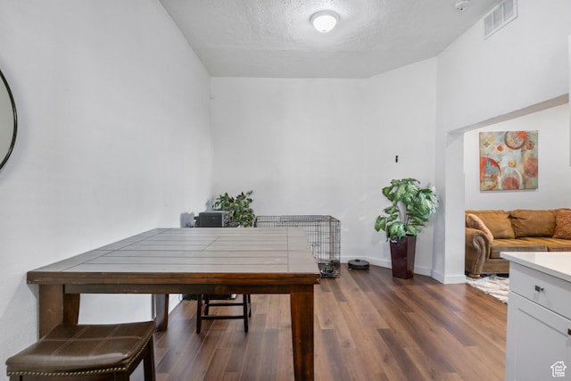 739 24th St, Ogden, UT 84401 - office with visible vents, baseboards, a textured ceiling, and dark wood finished floors