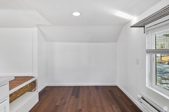 739 24th St, Ogden, UT 84401 - bonus room with dark wood finished floors, baseboards, lofted ceiling, and a baseboard radiator