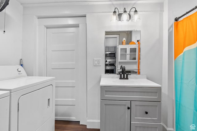 739 24th St, Ogden, UT 84401 - full bathroom featuring baseboards, wood finished floors, washing machine and dryer, and vanity