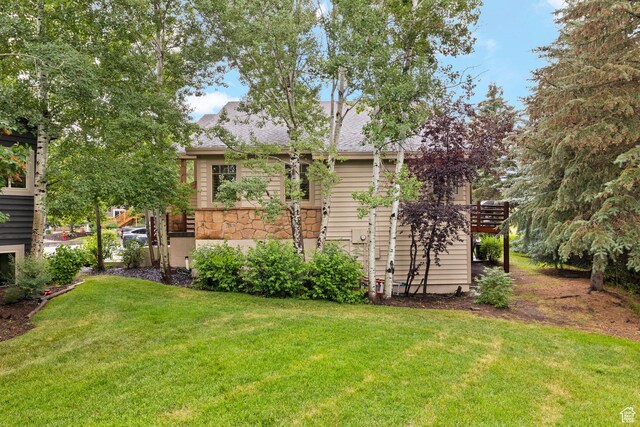 7494 Brook Hollow Loop Rd, Park City, UT 84098 - back of house with a yard, stone siding, a shingled roof, and a pergola