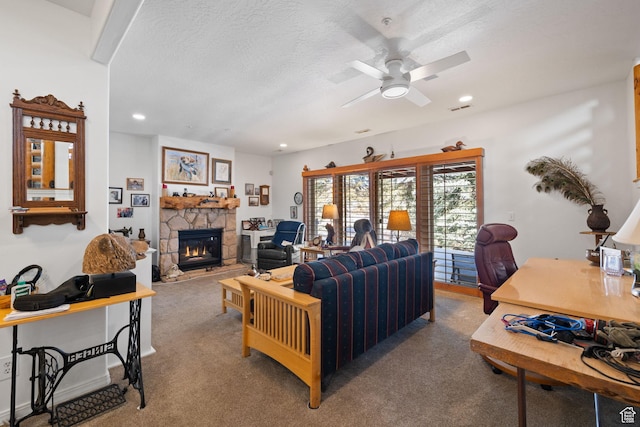 7494 Brook Hollow Loop Rd, Park City, UT 84098 - living room with visible vents, a ceiling fan, a textured ceiling, carpet, and a stone fireplace