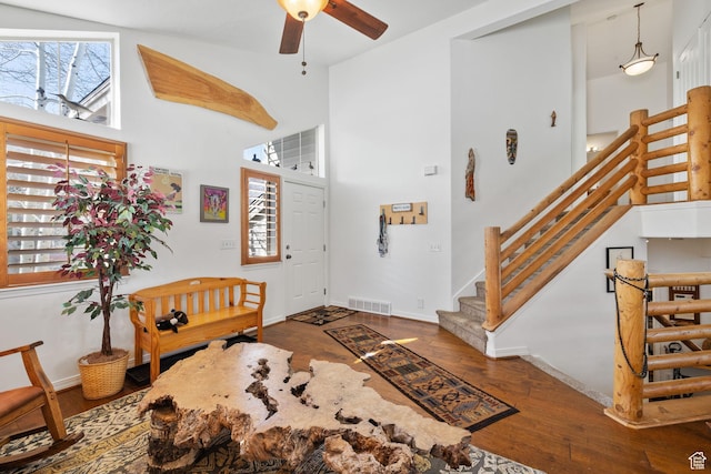 7494 Brook Hollow Loop Rd, Park City, UT 84098 - entryway featuring visible vents, baseboards, stairway, a high ceiling, and wood-type flooring