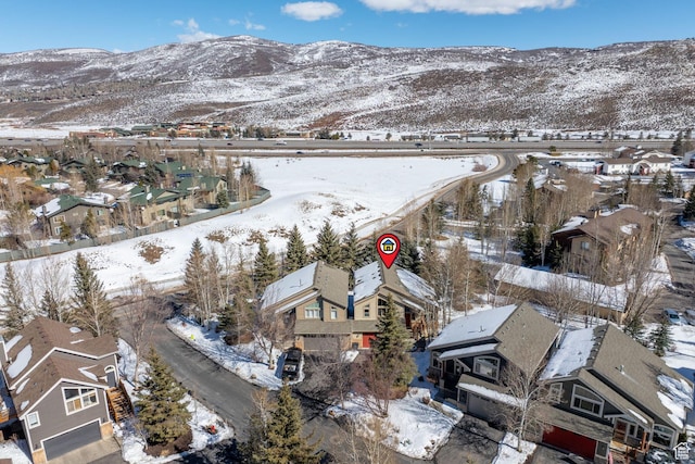 7494 Brook Hollow Loop Rd, Park City, UT 84098 - snowy aerial view featuring a mountain view and a residential view