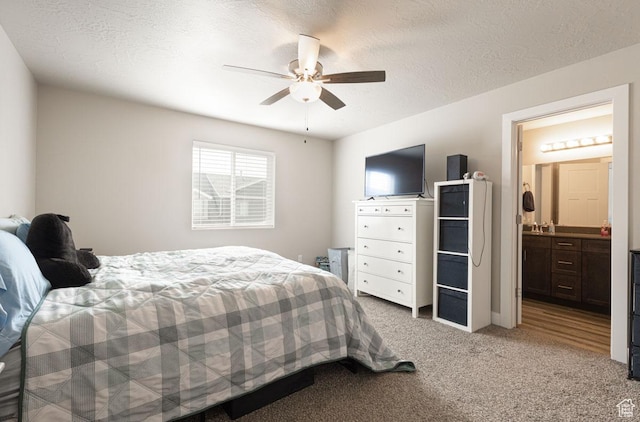 3180 W 1650 N Unit B, Cedar City, UT 84721 - carpeted bedroom featuring a textured ceiling, ensuite bathroom, and a ceiling fan