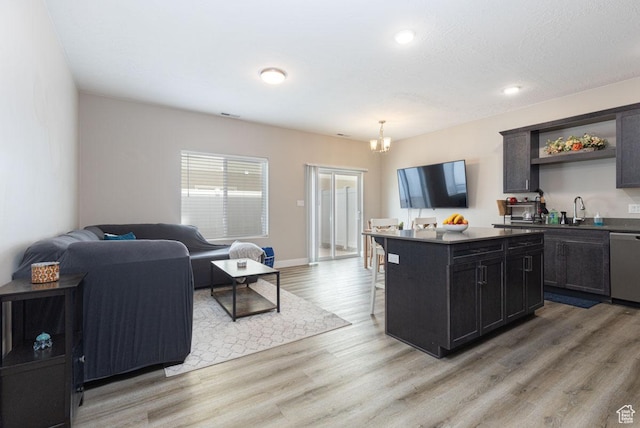 3180 W 1650 N Unit B, Cedar City, UT 84721 - kitchen featuring a center island, open floor plan, dishwasher, a kitchen bar, and light wood-type flooring
